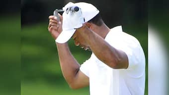 Woods's bid for world number one thwarted by storm