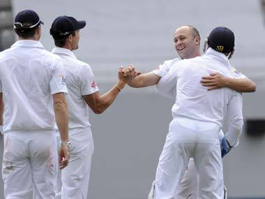 Jonathan Trott is hugged by the wicket keeper Matt Prior after they combined to dismiss Brendan McCullum for 38. AP