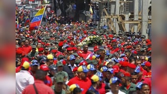 Mourners hail Hugo Chavez as spiritual father of Venezuela 