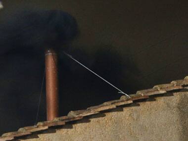 Black smoke rises from the chimney on the roof of the Sistine Chapel in the Vatican City indicating that no decision has been made after the first day of voting for the election of a new pope. Reuters
