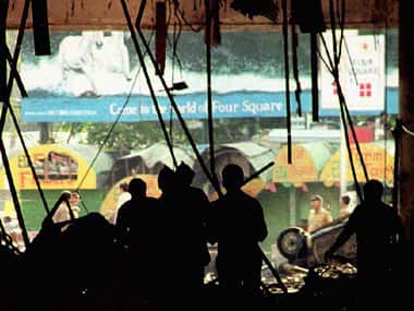 File photo: Indian officials inspect bomb damage in the basement of the Air India building, one of a series of bombs that rocked the western port city of Mumbai. AFP