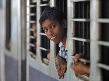 A young boy travelling in a sleeper coach of the Indian Railways. Reuters