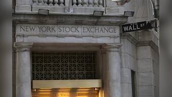 Wall Street up on healthcare; gold falls