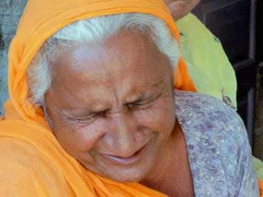 A relative of Bhullar reacts after hearing the apex court verdict. PTI