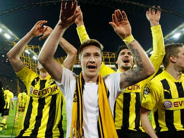 Borussia Dortmund's Marco Reus (C) and team mates celebrate after defeating Malaga to win the Champions League quarter-final. Reuters