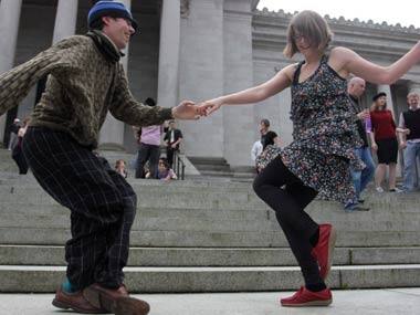 Dozens of Washington residents shake a leg to protest dance tax