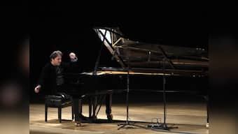 Tweeting Turkish pianist given suspended sentence for blasphemy