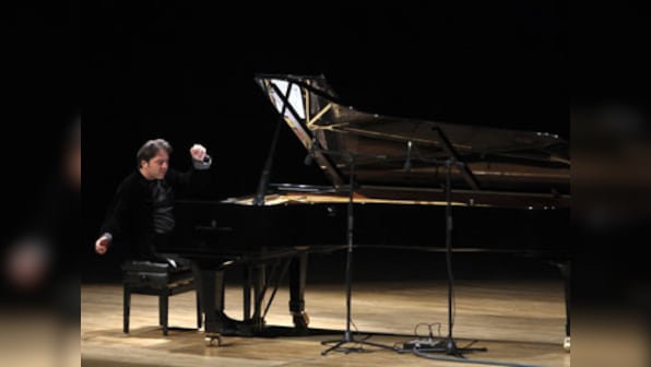 Tweeting Turkish pianist given suspended sentence for blasphemy