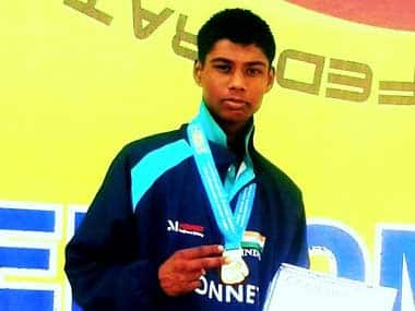 Prayag poses with his medal and certificate. IBF