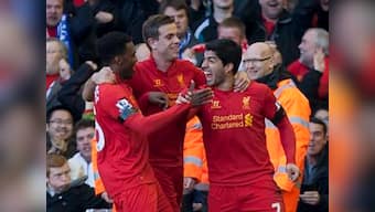 Suarez puts bite on Chelsea, City collapse at Spurs