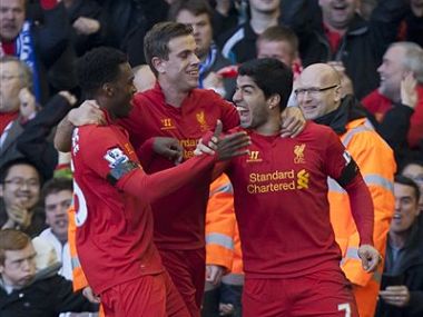 Suarez puts bite on Chelsea, City collapse at Spurs Suarez puts bite on Chelsea, City collapse at Spurs