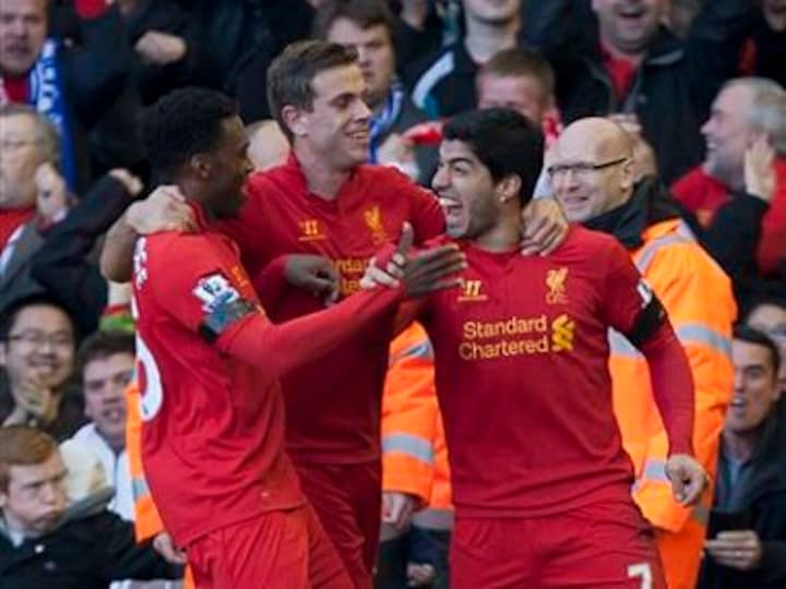 Suarez puts bite on Chelsea, City collapse at Spurs
