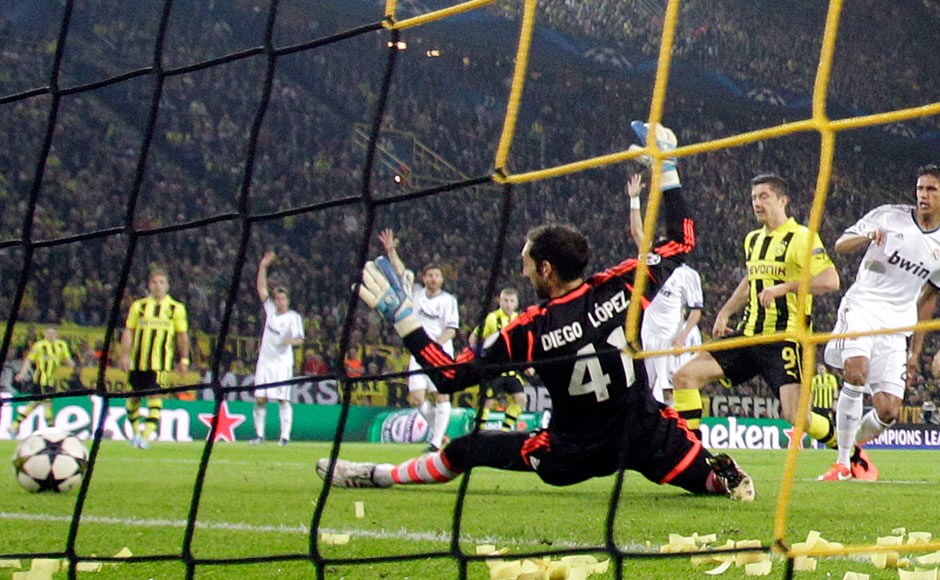Dortmund's Robert Lewandowski, from Poland, 2nd right, scores his second goal past Real Madrid's goalkeeper Diego Lopez. AP