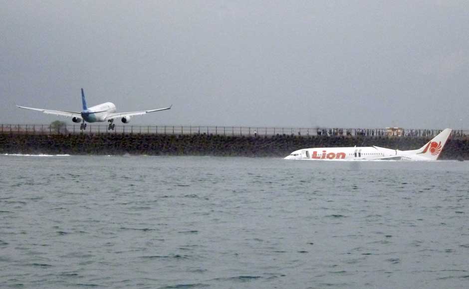 The wreckage a crashed Lion Air plane sits on the water near the airport in Bali, Indonesia on 13 April 2013. AP The wreckage a crashed Lion Air plane sits on the water near the airport in Bali, Indonesia on 13 April 2013. AP