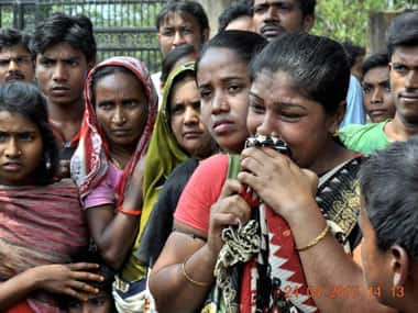 Lakhs of investors have been duped by Saradha scheme. Seen here are investors breaking down in front of Saradha office in Malda. PTI. 