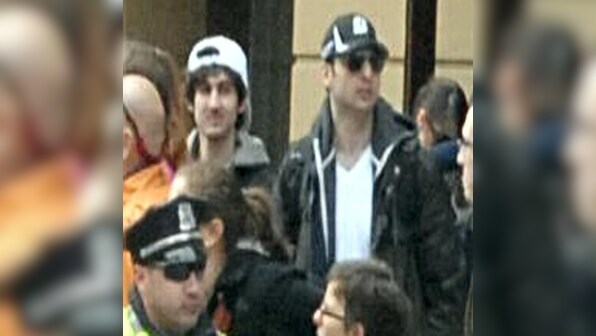One Boston blasts suspect dead; police ask residents to 'stay home'