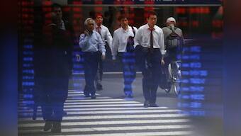 Dollar near 10-month peak on Fed remarks; Asian shares mixed