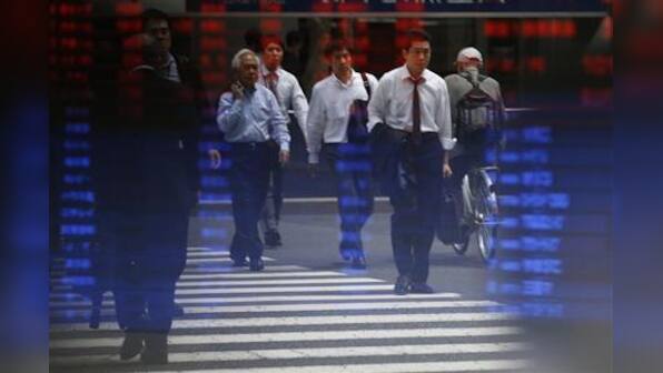 Dollar near 10-month peak on Fed remarks; Asian shares mixed