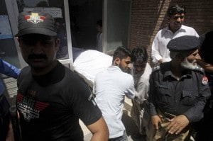 Pakistani hospital staff transfer the body of jailed Indian spy Sarabjit Singh after an autopsy at a local hospital in Lahore: AFP