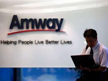 A man looks at his laptop outside Amway's sales showroom in Taipei. Reuters 