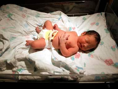 Baby Cin sleeps shortly after being born at Avista Adventist hospital in Louisville