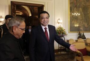Chinese Premier Li Keqiang arrives for a meeting with Indian President Pranab Mukherjee. AP.