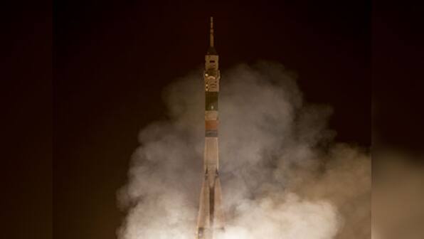 Russia's Soyuz capsule with three astronauts on board docks with space station