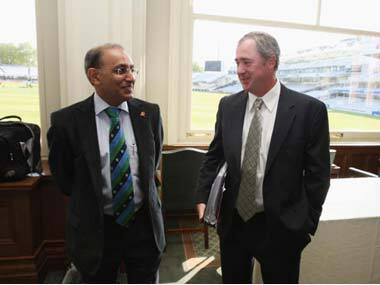 Tim May (R) with former ICC chief executive Haroon Lorgat. Getty