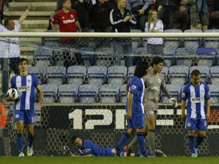 Wigan stare at relegation after loss to Swansea