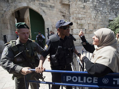 Jerusalem's Al-Aqsa mosque reopens after attack, but Muslims refuse to enter, citing new security measures Jerusalem's Al-Aqsa mosque reopens after attack, but Muslims refuse to enter, citing new security measures