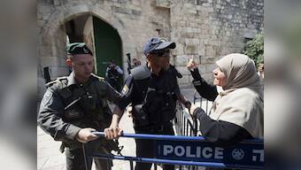 Jerusalem's Al-Aqsa mosque reopens after attack, but Muslims refuse to enter, citing new security measures
