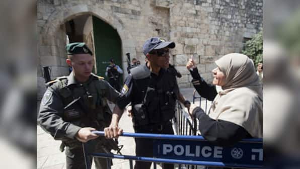 Jerusalem's Al-Aqsa mosque reopens after attack, but Muslims refuse to enter, citing new security measures