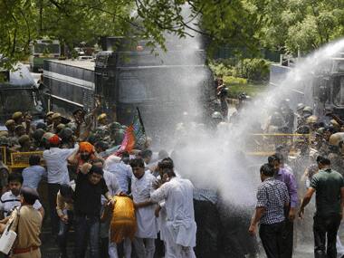 Police disperse protesters with water canons in Delhi. Reuters.