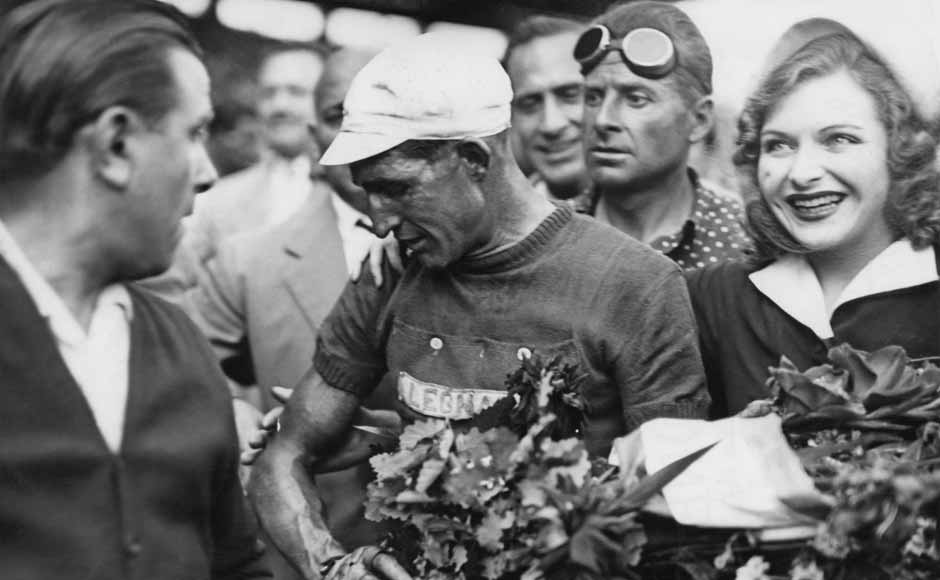 Italian racing cyclist Gino Bartali (1914 - 2000) at the Parc des Princes, Paris, after winning the Tour de France for the second time, 25th July 1948. Getty Images