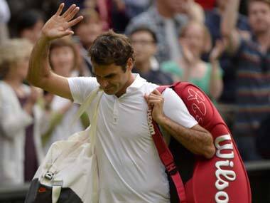 A disconsolate Roger Federer walks off Centre Court after losing in the second round at Wimbledon. AP
