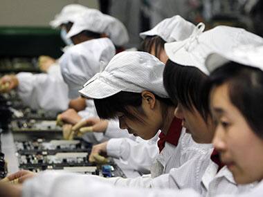 Workers at Foxconn factory. AP 