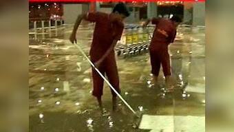 Monsoon woes: Passengers battle knee-deep water at Delhi airport