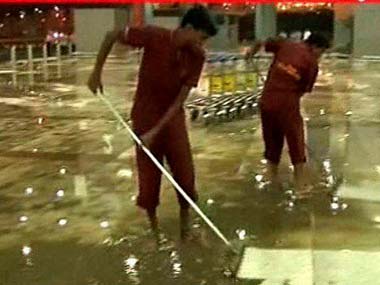 Monsoon woes: Passengers battle knee-deep water at Delhi airport Monsoon woes: Passengers battle knee-deep water at Delhi airport