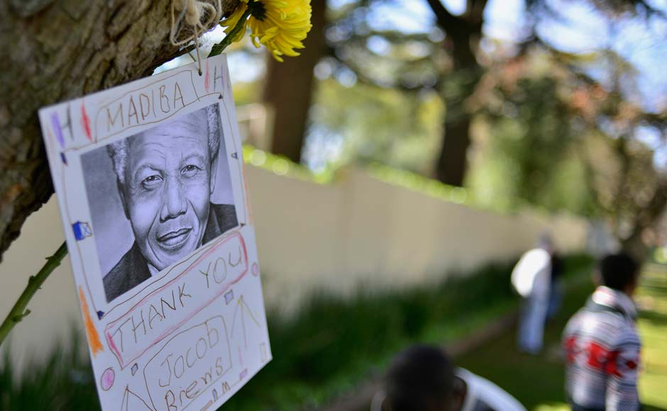 A message of support hangs from a tree outside the home of former President Nelson Mandela in Houghton, Johannesburg: Reuters A message of support hangs from a tree outside the home of former President Nelson Mandela in Houghton, Johannesburg: Reuters