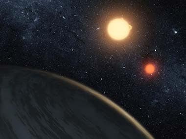 This artist's concept illustrates Kepler-16b, the first planet known to definitively orbit two stars -- what's called a circumbinary planet. The planet, which can be seen in the foreground, was discovered by NASA's Kepler mission. Image via NASA. 