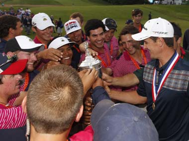 Justin Rose shows off his US Open trophy. Reuters