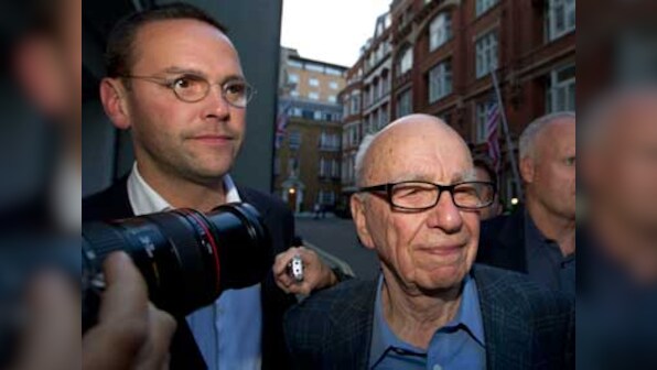 Moving on from scandal: Murdoch's News International changes name, logo