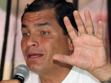 Ecuador’s President Rafael Correa talks with journalists on Thursday. AP image