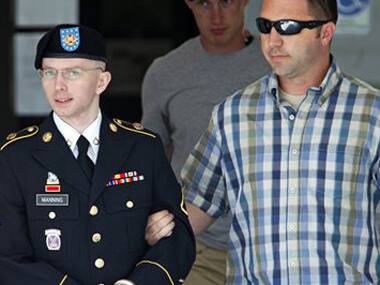 Bradley Manning being escorted out of a courthouse. AP image