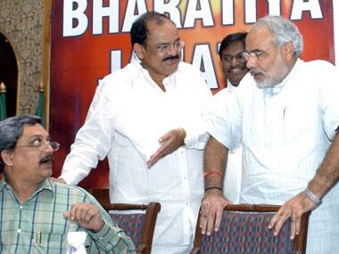 Parrikar (extreme left) with Narendra Modi (extreme right) at a BJP meet. AFP.