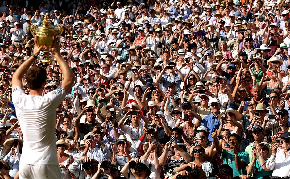 Fans cheer and take photographs as Andy Murray of Great Britain poses with the Gentlemen's Singles Trophy following his victory in the Gentlemen's Singles Final match against Novak Djokovic at Wimbledon. Clive Brunskill/Getty Images Fans cheer and take photographs as Andy Murray of Great Britain poses with the Gentlemen's Singles Trophy following his victory in the Gentlemen's Singles Final match against Novak Djokovic at Wimbledon. Clive Brunskill/Getty Images