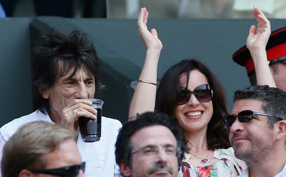 Ronnie Wood (top left), of the Rolling Stones, sits on Centre Court for the men's singles final tennis match between Andy Murray and Novak Djokovic. Stefan Wermuth/Reuters Ronnie Wood (top left), of the Rolling Stones, sits on Centre Court for the men's singles final tennis match between Andy Murray and Novak Djokovic. Stefan Wermuth/Reuters