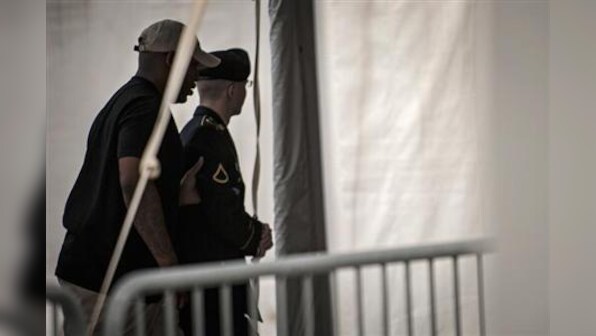 Manning acquitted of aiding enemy, still may face long jail term