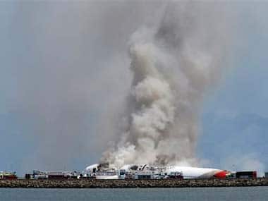 Smokes rises from Asiana Flight 214 after it crashed at San Francisco International Airport: AP