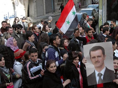 Assad claims Syrian revolution is a conspiracy by West – Firstpost